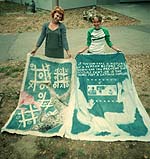Photo of students with artwork.