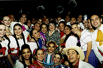 [Photo of Grupo Folklorico people and chancellor]