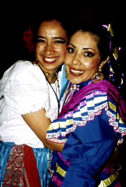 [Photo of Grupo Folklorico dancer and Olga Najera Ramirez]
