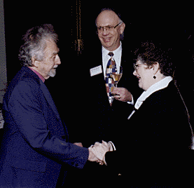 [Photo of Chancellor Greenwood greeting Charles Griffin Farr, with dean of arts Edward Houghton]