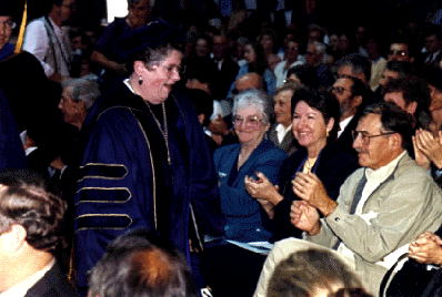 Photo of Chancellor Greenwood, greeting guests as she departs Friday's inaugural ceremony in the East Field House.