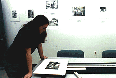 Photo of Eva Rubin with photo at cutting board
