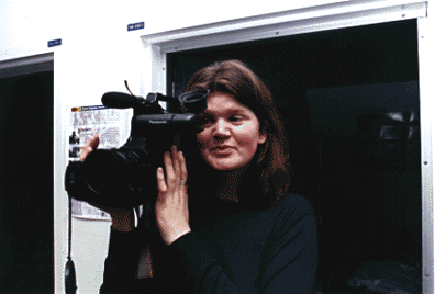 Photo of Laura Jones looking through video camera