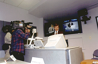 [Photo of Michael Tanner and news crews]