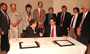 [Photo of Chancellor Greenwood, faculty, and members of CAS]