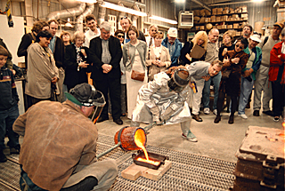 [Photo of bronze pouring]