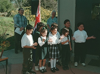 [Photo of singing first-graders from MacQuiddy Elementary School]