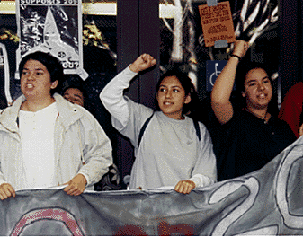 [Picture of three female students at Hahn protest]