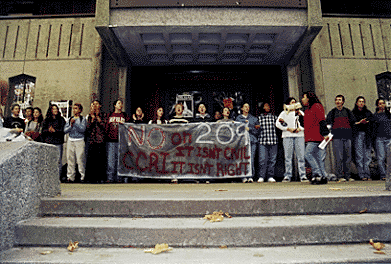 [Picture students blocking entrance to the Hahn Student Services Building]