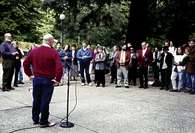 [Photo of Tom Graves singing at the AIDS vigil.]