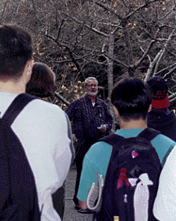 [Photo of Carter Wilson speaking to crowd]