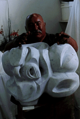 Photo of Manuel Santana with sculpture