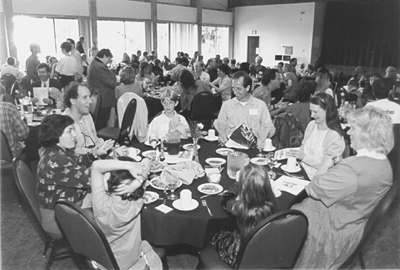 [Photo of several families at reunion luncheon]