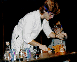 [Photo of
researcher with young student at Discovery Museum]
