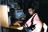 [Photo of Eugene Ghymn at his computer]