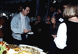 [Photo of faculty at food table]