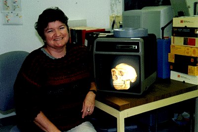 [Photo of Diane Gifford-Gonzalez and skull]