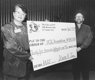 [Photo of M.R.C. Greenwood and Steve Jung with check]