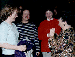 [Photo of Chancellor Greenwood greeting three women at the
annual holiday party at University House]