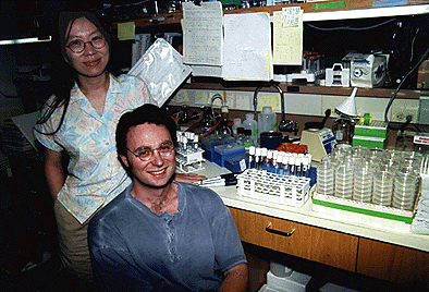 [Photo of Yishi Jin and Andrew Chisholm in lab]