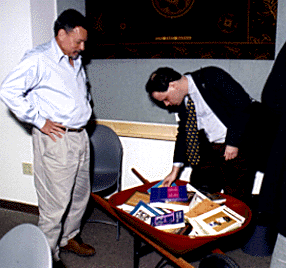 [Jorge Hankamer and regent XX with wheelbarrow full of books]