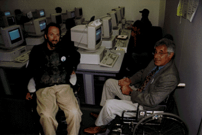 [Picture of Associate Vice Chancellor Fred Siff and Shared Adventures director Foster Andersen in Ming Ong Computer Lab]