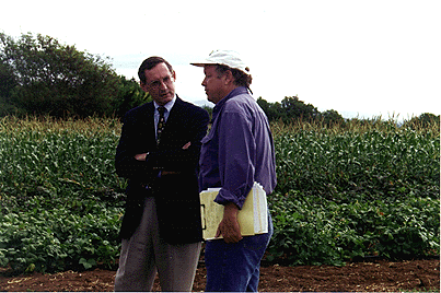 [Photo of Bob Scowcroft talking with Jim Parker]