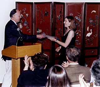 [Photo Ed Houghton giving an award to a student]