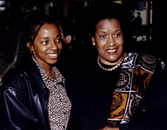 [Photo of Myrlie Evers-Williams and a high school student]