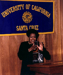 [Photo of Myrlie Evers-Williams at a press conference]