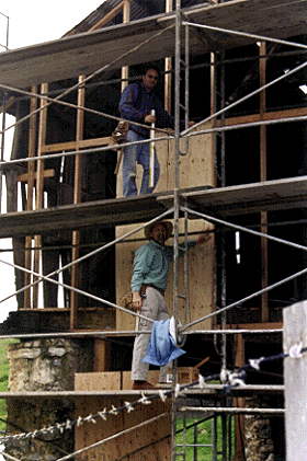 [Photo of Dan Flasher and Alan Speidel putting wall up on Cooperage]