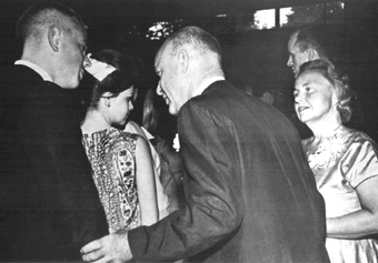 [Photo of Dean McHenry and his wife Jane McHenry at a reception]