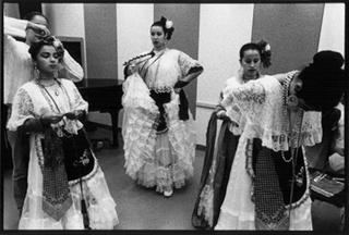 [Photo of Mejicas preparing for performance]