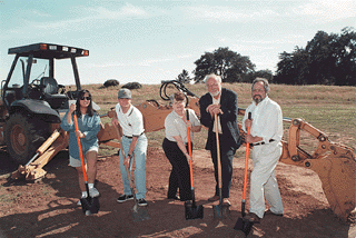 [Photo of Chancellor Greenwood, other administrators, and students with ceremonial shovels at the groundbreaking]