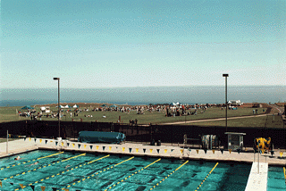 [Photo of the East Field swimming pool, with the fair taking place in the background]