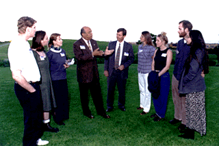 [Photo of Peace Corps Deputy Director Charles Baquet and Executive Vice Chancellor Michael Tanner with future Peace Corps students]