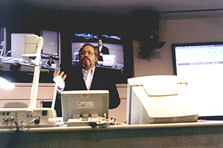 [Photo of Francisco Hernandez at videoconferencing terminal]