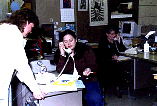 [Photo of Chancellor Greenwood and students making outreach calls]