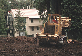 [Photo of bulldozer at construction site]