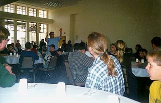 [Photo of UCSC students having dinner with members of the Choir Society from Biberach, Germany]
