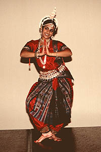 [Photo of dancer performing classical Indian dance]