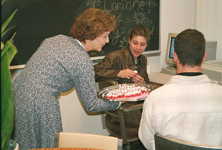 [Photo of Sally Lester and students]